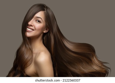 Portrait of a beautiful brunette woman with long wavy hair. Copycpase - Shutterstock ID 2122360337