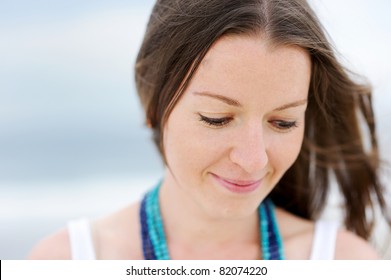 Portrait Of A Beautiful Brunette Woman Looking Down