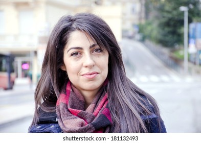 Portrait of beautiful brunette woman outdoor