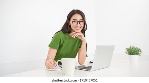 Portrait of beautiful business asian korean designer woman working  office desk using computer Small business freelance girl. Successful business people japanese employee, sme online virtual marketing