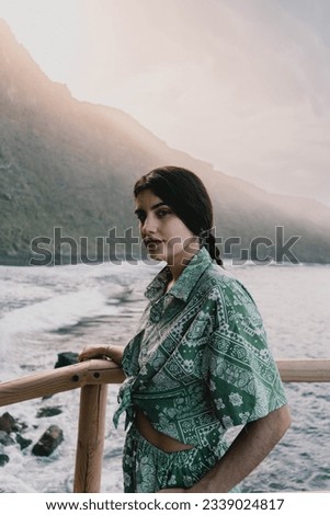 Portrait of a beautiful Caucasian woman in the middle of a natural landscape