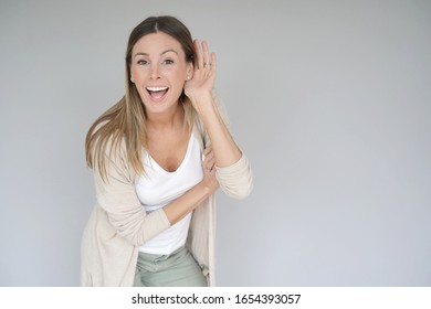 Portrait of beautiful and cheerful woman on grey background, isolated - Shutterstock ID 1654393057