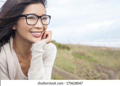 Portrait Of A Beautiful Chinese Asian Girl Or Young Woman Outside Wearing Glasses