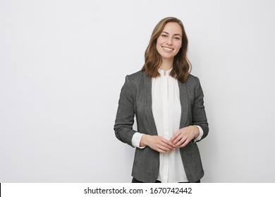 Portrait Of Beautiful And Confident Young Business Woman And Person In Studio Looking Executive And Professional, Isolated On White. Concept: Successful Businesswoman. 