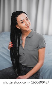 Portrait of a beautiful cool girl with Senegalese pigtails twists