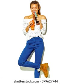 Portrait Of Beautiful Crazy Smiling Brunette Woman Girl In Casual Blue Hipster Summer Clothes With No Makeup Isolated On White Drinking Soda From Two Bottles With Straw