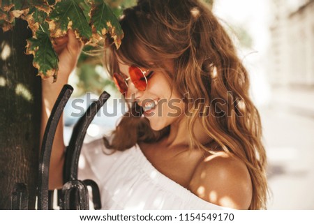 Portrait Of Beautiful Cute Blond Teenager Model With No Makeup In Summer Hipster White Dress Clothes Portrait Of Beautiful Cute Blond Teenager Model With No Makeup In Summer Hipster White Dress Clothes