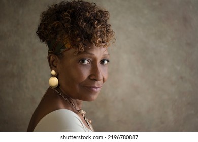 Portrait of a beautiful elderly 70-year-old African-American grandma spokesperson looking back over shoulder with ad or copy space for your ad - Shutterstock ID 2196780887