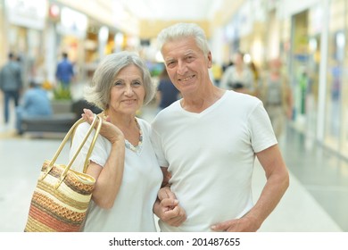 Portrait Of Beautiful Elderly Couple In Shopping Mall