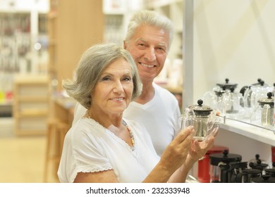 Portrait Of Beautiful Elderly Couple In Shopping Mall