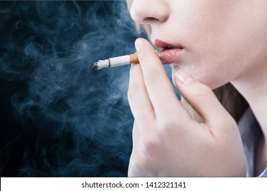 Portrait of the beautiful elegant girl smoking cigarette isolated - Shutterstock ID 1412321141