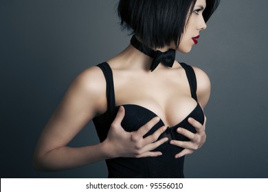 portrait of a beautiful elegant woman in lingerie on a dark background