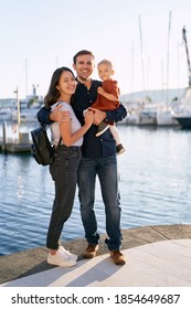 A Portrait Of A Beautiful Family On A Boat Pier By The Sea