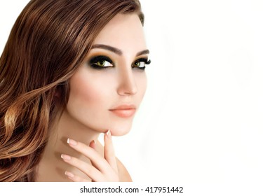 Portrait Of Beautiful Fashion Model With Bright Eye Make Up And Long Wavy Hair.  Perfect Fresh Skin And Long Eyelashes.  Make Up And Hair. Lashes.