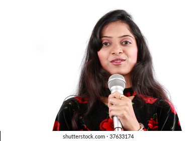 A Portrait Of A Beautiful Female Host Of A Talk Show In India, On White Studio Background.