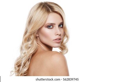 Portrait Of Beautiful Female Model Looking Over A Shoulder On White Background