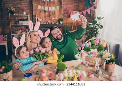 Portrait of beautiful full family make selfie portrait bunny ears fresh tulips gift present home indoors - Powered by Shutterstock