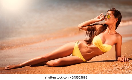 Portrait Beautiful Fun Joy Sexy Smiling Brunette Woman Yellow Bikini Sunglasses Cream Tropical Hot Sun Blue Sea Water Resort Sport Athletic Tan Skin Body Slim Travel Nature Lifestyle  Fresh Adventure