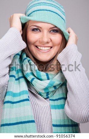 Portrait of a beautiful,  funny girl in warm clothing