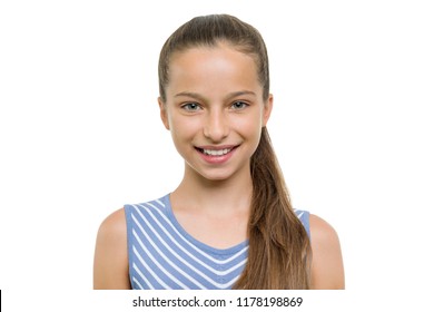 Portrait of beautiful girl of 10, 11 years old. Child with perfect white smile, isolated on white background.