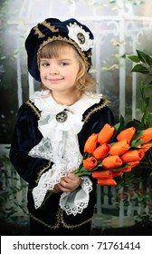 Portrait Of A Beautiful Girl In A Blue Suit And An Old Pick A Bouquet Of Red Tulips