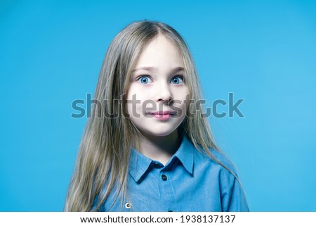Portrait of a beautiful girl child in the studio