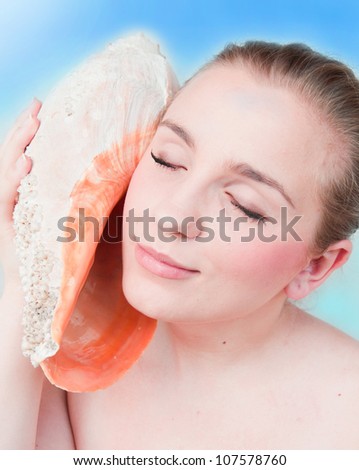 Portrait of a beautiful girl a conch shell