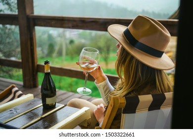                      
Portrait Of A Beautiful Girl Drinks Wine In Her Country House With Mountain Views          