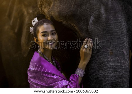 portrait of beautiful girl with elephant backgrounds.                               