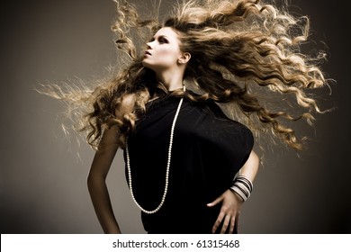 Portrait Of A Beautiful Girl With Flying Blond Hair