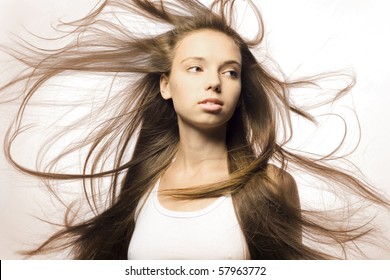 Portrait Of A Beautiful Girl With Flying Hair