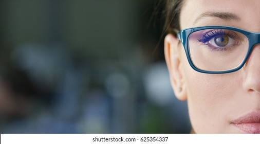 Portrait of a beautiful girl with glasses, eyes closed, shot close-up, on a blurred background. Concept: beautiful eyes, beautiful smile, vision, perfect skin.
				