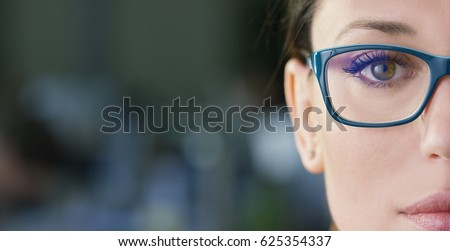 Portrait of a beautiful girl with glasses, eyes closed, shot close-up, on a blurred background. Concept: beautiful eyes, beautiful smile, vision, perfect skin.
