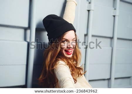 Similar – Young happy woman sticking out her tongue