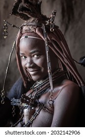 Portrait of a beautiful girl from the Himba tribe, Namibia.  The Himbas are a tribe from North Namibia and South Angola. - Shutterstock ID 2032142906