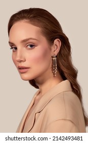 Portrait Of A Beautiful Girl With A Long Chandelier Earring With Pearls, Crystal Beads And White Rhinestones. The Brown-haired Lady In The Beige Blouse Is Posing On The Light Background. 