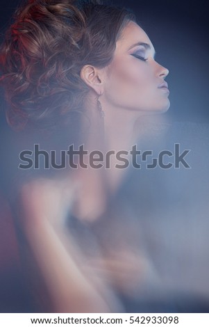 Similar – Young woman in black lingerie in chiaroscuro lighting