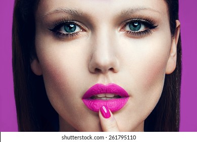 Portrait of beautiful girl with pink lips and blue eyes
