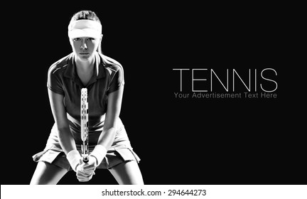 Portrait of beautiful girl tennis player with a racket isolated on black background