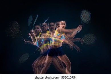 Portrait of beautiful girl tennis player with a racket on dark background - Powered by Shutterstock