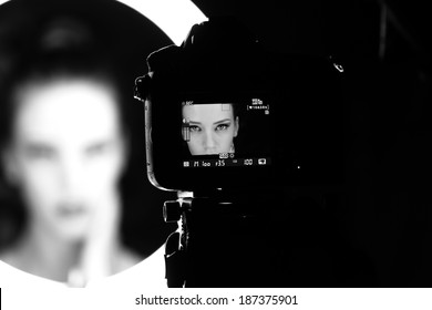 Portrait of a beautiful girl through lens - Shutterstock ID 187375901