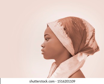 Portrait of a beautiful girl wearing a headscarf, profile view 