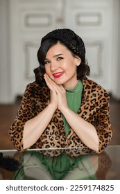 portrait of beautiful and happy brunette in retro clothes and beret. the concept of the stylist's work. thematic photo shoot. - Shutterstock ID 2259174825