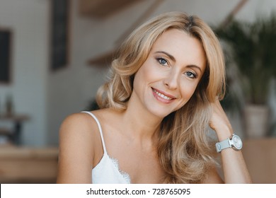 Portrait Of Beautiful Happy Middle Aged Woman Smiling At Camera