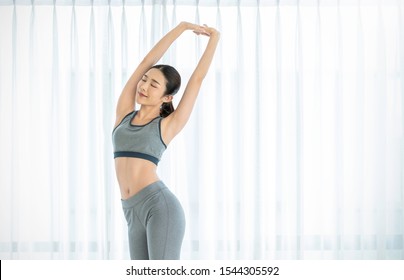 Portrait Of Beautiful Healthy Armpit Waxing Asian Woman With Sport Wear On White Background. People Beauty Perfect Body Slim Fit. Happy Sexy Girl Relax Copy Space. Lifestyle Healthcare Fitness Concept