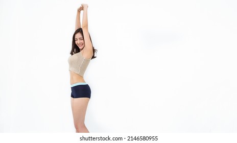 Portrait of beautiful healthy slim asian show armpit waxing woman casual with copy space white background. People beauty perfect body slim fit fitness sexy girl. Freedom lifestyle healthcare concept