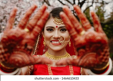 Portrait Of A Beautiful Indian Bride In A Traditional Wedding Dress