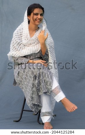 Portrait of beautiful Indian girl wearing Indian traditional dress salwar Kameez and Dupatta