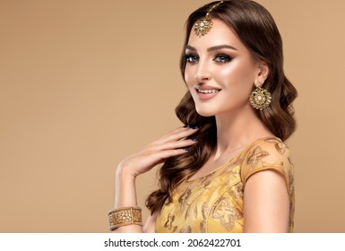 Portrait of beautiful indian girl. Young India woman model with kundan jewelry set. Traditional Indian costume lehenga choli or sari - Shutterstock ID 2062422701