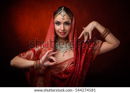 Portrait of beautiful indian girl . Young hindu woman model kundan jewelry . Traditional costume